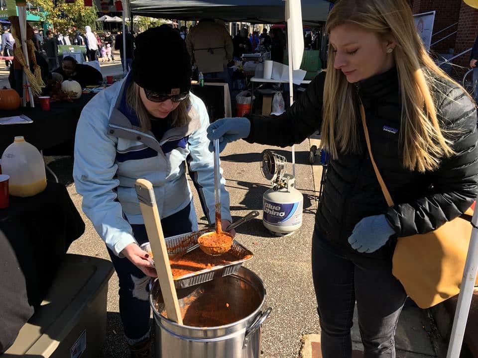 A spoonful of red sauce at a community event