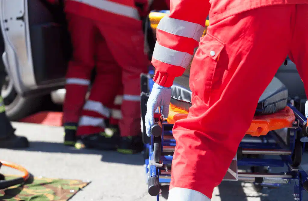 EMTs helping car accident victim