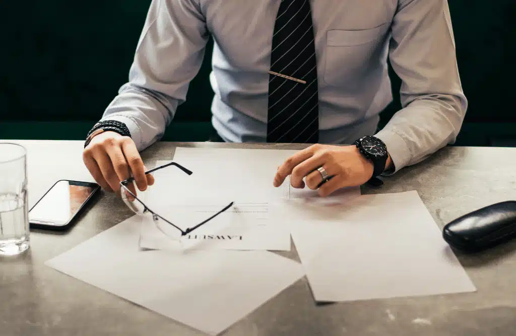 man looking at a lawsuit file