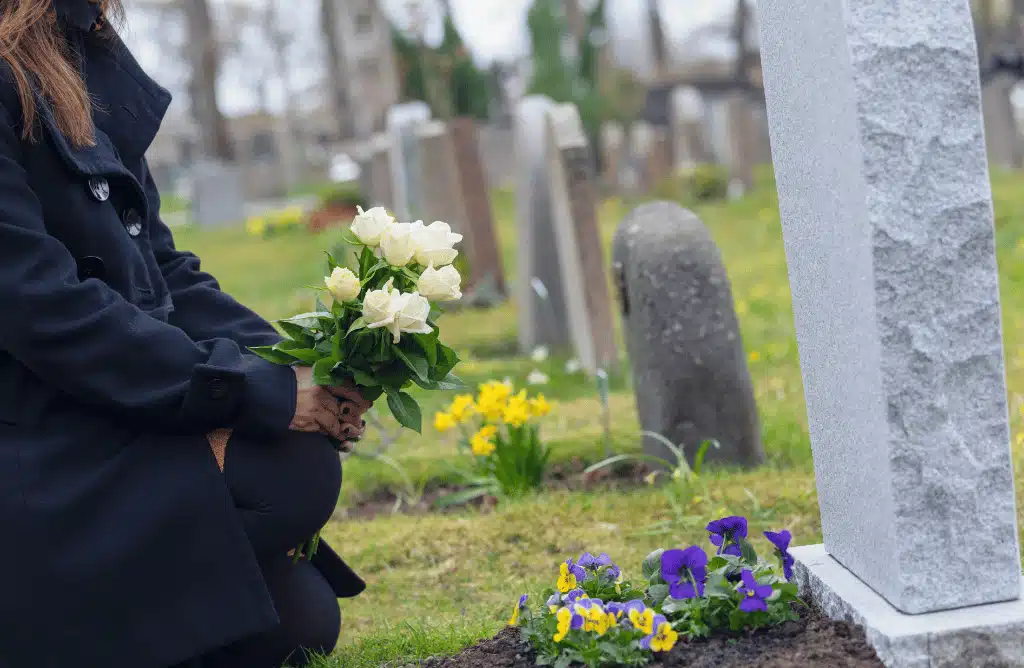 Placing-flowers-at-loved-ones-grave