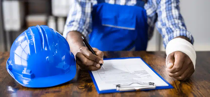 A construction worker signing a form