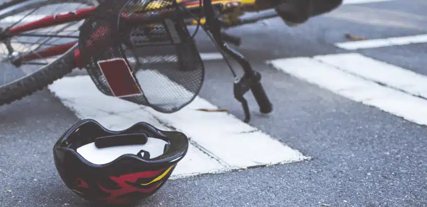 A bicycle fallen on the road