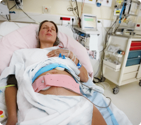 A pregnant mother recovering after childbirth