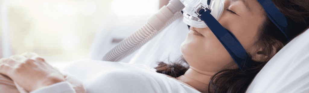 woman sleeping with cpap machine