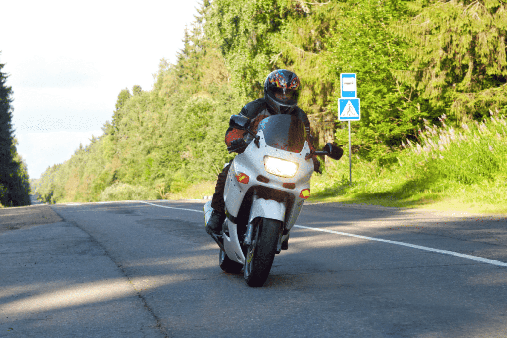 Motorcyclist driving down the road